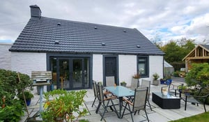 A Scottish house that has undergone a full house external refurbishment demonstrating the effectiveness of thorough exterior maintenance in preserving the structure's integrity and longevity.