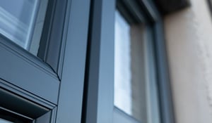 A house in Scotland freshly rejuvenated with its UPVC windows expertly sprayed, giving them a vibrant, brand-new appearance.